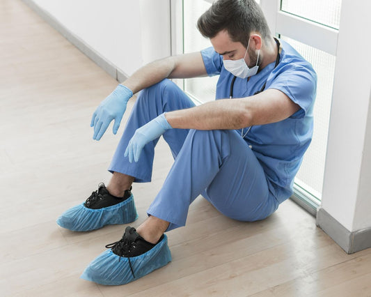 Healthcare worker standing on feet during long work shift